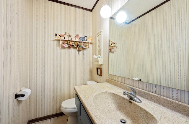 1027 Peggys Cv, Reynoldsburg, OH 43068 - bathroom with wallpapered walls, crown molding, toilet, vanity, and tile patterned floors