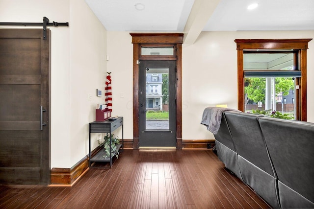 540 Linwood Ave, Columbus, OH 43205 - entrance foyer with baseboards, dark wood finished floors, and a barn door