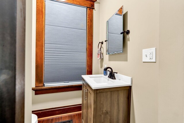 540 Linwood Ave, Columbus, OH 43205 - bathroom with vanity, toilet, and wood finished floors