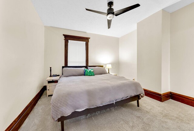 540 Linwood Ave, Columbus, OH 43205 - bedroom with light carpet, baseboards, and ceiling fan