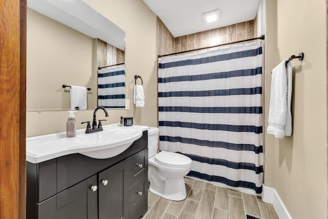 540 Linwood Ave, Columbus, OH 43205 - bathroom with vanity, toilet, and curtained shower