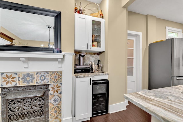 540 Linwood Ave, Columbus, OH 43205 - kitchen with freestanding refrigerator, wine cooler, dark wood-style flooring, white cabinets, and glass insert cabinets