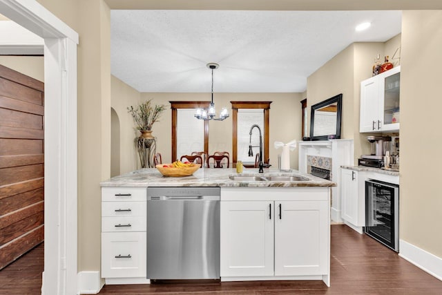 540 Linwood Ave, Columbus, OH 43205 - kitchen featuring dishwasher, wine cooler, a sink, a chandelier, and light stone counters