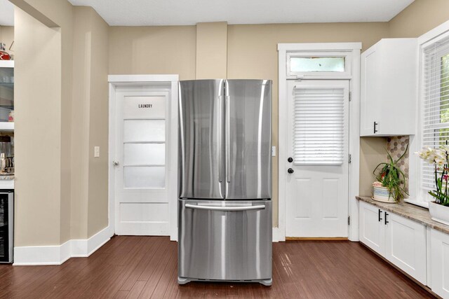 540 Linwood Ave, Columbus, OH 43205 - kitchen featuring freestanding refrigerator, dark wood-type flooring, white cabinetry, beverage cooler, and light stone counters