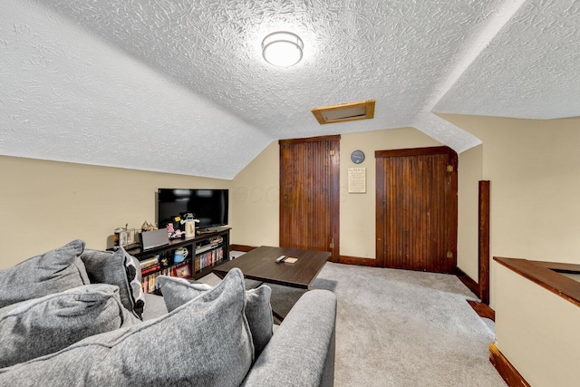 540 Linwood Ave, Columbus, OH 43205 - carpeted living area with a textured ceiling, attic access, lofted ceiling, and baseboards