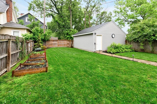 540 Linwood Ave, Columbus, OH 43205 - view of yard featuring a vegetable garden and an outbuilding