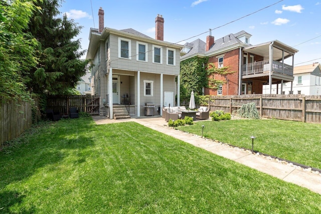 540 Linwood Ave, Columbus, OH 43205 - back of house with an outdoor living space and a chimney