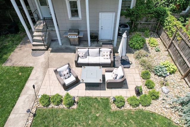 540 Linwood Ave, Columbus, OH 43205 - fenced backyard with an outdoor hangout area, a patio area, and a grill