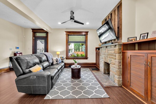 540 Linwood Ave, Columbus, OH 43205 - living room featuring ceiling fan, wood finished floors, baseboards, recessed lighting, and a stone fireplace