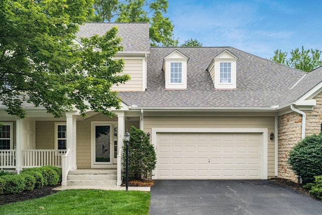 6618 Wild Rose Ln, Westerville, OH 43082 - view of front facade featuring driveway, roof with shingles, a garage, and covered porch