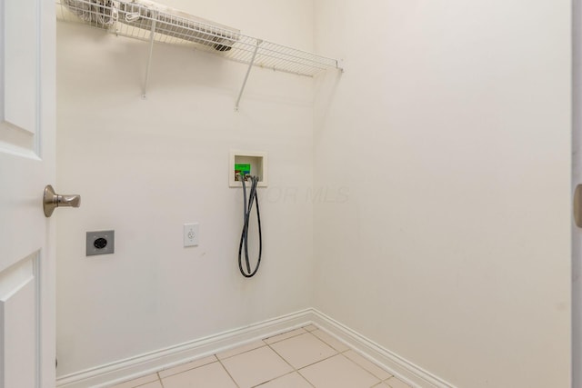 6618 Wild Rose Ln, Westerville, OH 43082 - laundry room featuring electric dryer hookup, washer hookup, baseboards, and light tile patterned flooring
