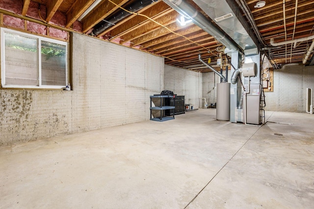 6618 Wild Rose Ln, Westerville, OH 43082 - below grade area featuring water heater, heating unit, and brick wall