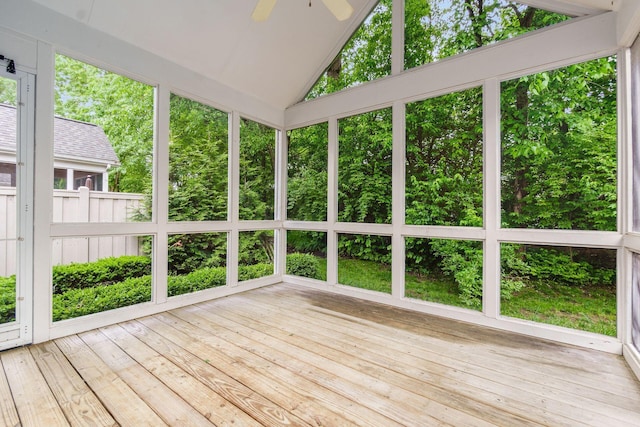 6618 Wild Rose Ln, Westerville, OH 43082 - unfurnished sunroom featuring a wooden deck, a ceiling fan, vaulted ceiling, and wood-type flooring