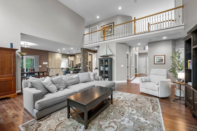 6034 Heritage View Ct, Hilliard, OH 43026 - living room with a towering ceiling, dark wood-type flooring, recessed lighting, and baseboards