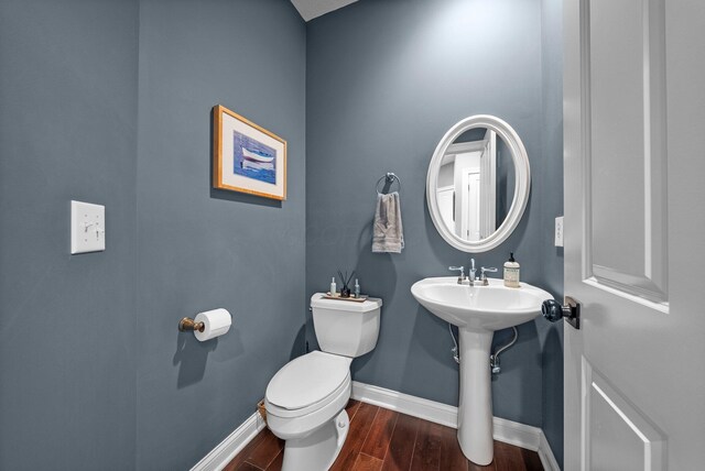6034 Heritage View Ct, Hilliard, OH 43026 - bathroom with baseboards, wood finished floors, and toilet