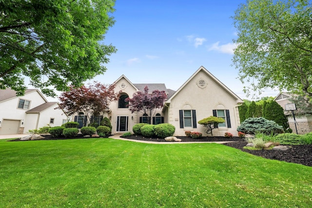 6034 Heritage View Ct, Hilliard, OH 43026 - view of front facade with a front yard and stucco siding