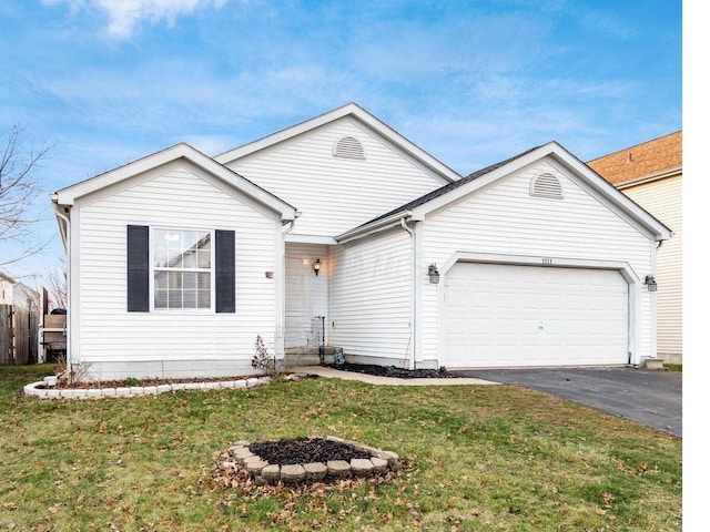 1111 Greeley Dr, Galloway, OH 43119 - ranch-style house with an attached garage and driveway