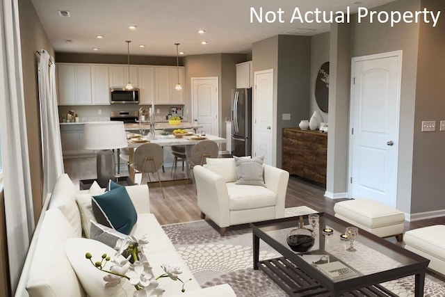 520 Penwell Dr Lot 13897, Delaware, OH 43015 - living area featuring light wood-type flooring and recessed lighting