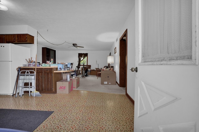7682 Northridge Rd, Johnstown, OH 43031 - kitchen with freestanding refrigerator, a desk, ceiling fan, and open floor plan