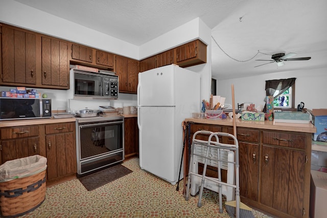 7682 Northridge Rd, Johnstown, OH 43031 - kitchen with black microwave, freestanding refrigerator, electric range, and light countertops