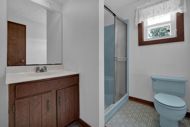 7682 Northridge Rd, Johnstown, OH 43031 - bathroom with a stall shower, toilet, baseboards, vanity, and a textured ceiling