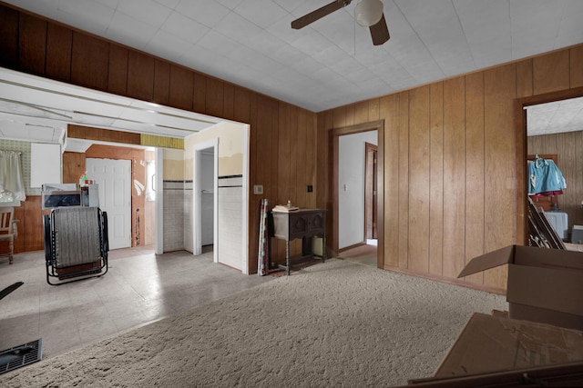 7682 Northridge Rd, Johnstown, OH 43031 - living room featuring wood walls, ceiling fan, and tile patterned floors