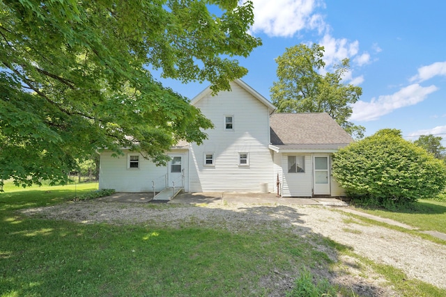 7682 Northridge Rd, Johnstown, OH 43031 - rear view of property with a lawn and a shingled roof