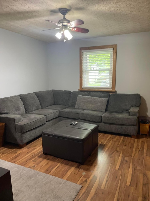314 Broken Arrow Rd, Columbus, OH 43230 - living room featuring a textured ceiling, wood finished floors, and ceiling fan