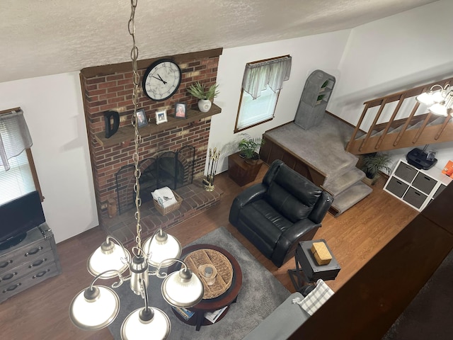 314 Broken Arrow Rd, Columbus, OH 43230 - living area featuring wood finished floors, a textured ceiling, and a fireplace