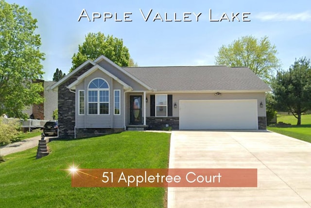 51 Appletree Ct, Howard, OH 43028 - view of front of house with concrete driveway, an attached garage, a front yard, and stone siding