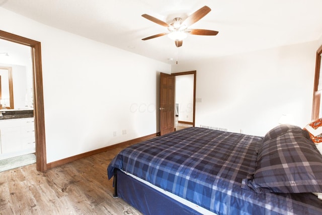 51 Appletree Ct, Howard, OH 43028 - bedroom with wood finished floors, baseboards, connected bathroom, and a ceiling fan