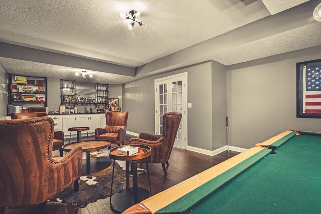 2505 Isabella Blue Dr, Powell, OH 43065 - game room with a dry bar, wood finished floors, a textured ceiling, baseboards, and french doors