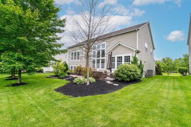 2505 Isabella Blue Dr, Powell, OH 43065 - rear view of property with a yard, central air condition unit, and a patio area
