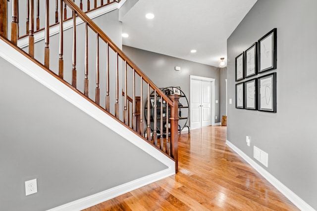 2505 Isabella Blue Dr, Powell, OH 43065 - foyer entrance featuring wood finished floors, baseboards, stairway, and recessed lighting