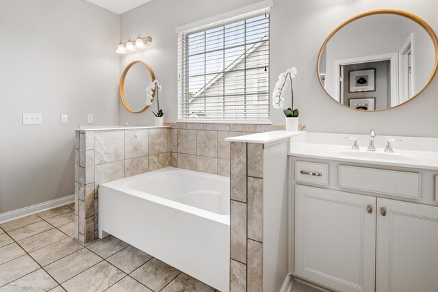 2505 Isabella Blue Dr, Powell, OH 43065 - full bath with a garden tub, tile patterned floors, vanity, and baseboards