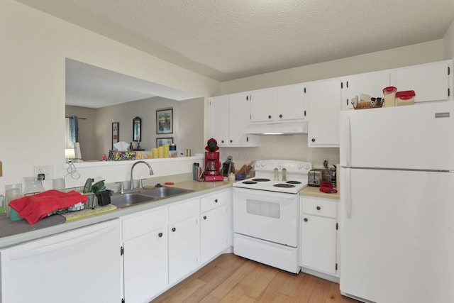 991 Annagladys Dr Unit R4, Columbus, OH 43085 - kitchen with white appliances, a sink, under cabinet range hood, light countertops, and white cabinets
