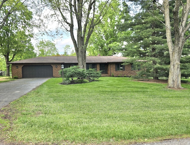146 Knoll Dr, Granville, OH 43023 - ranch-style house featuring asphalt driveway, an attached garage, brick siding, and a front lawn