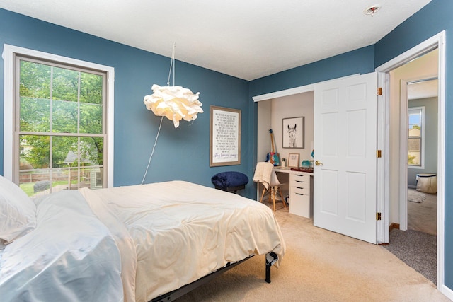 1315 Shelby Cir, Reynoldsburg, OH 43068 - bedroom with light colored carpet and a chandelier