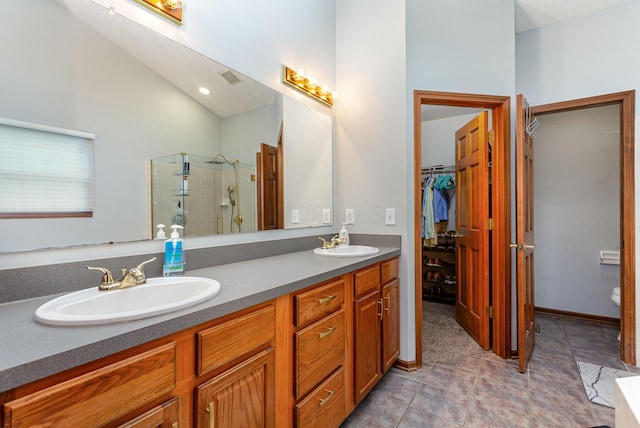 1315 Shelby Cir, Reynoldsburg, OH 43068 - full bathroom with tiled shower, double vanity, a spacious closet, and lofted ceiling