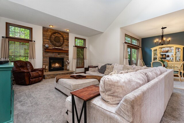 1315 Shelby Cir, Reynoldsburg, OH 43068 - carpeted living area featuring a chandelier, a fireplace, plenty of natural light, and vaulted ceiling