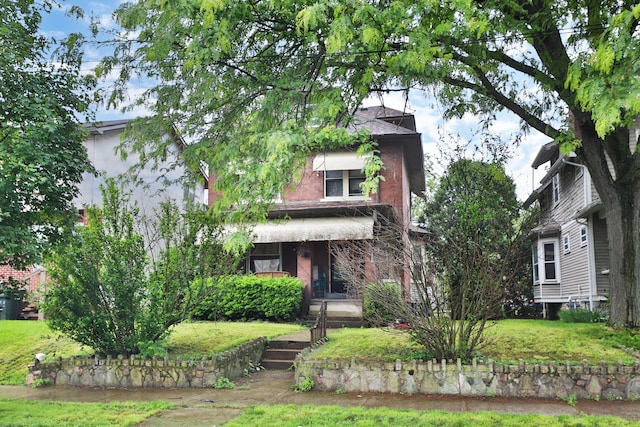 368 Alden Ave Unit 368, Columbus, OH 43201 - view of front of house with brick siding and a front lawn