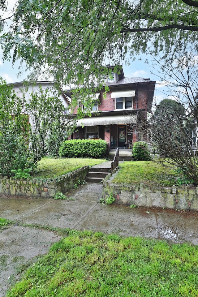 368 Alden Ave Unit 368, Columbus, OH 43201 - view of front facade featuring a front lawn and brick siding