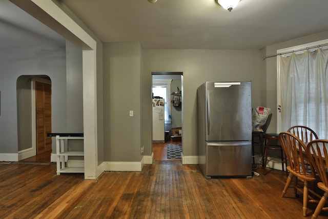 368 Alden Ave Unit 368, Columbus, OH 43201 - kitchen with freestanding refrigerator, hardwood / wood-style flooring, arched walkways, and baseboards