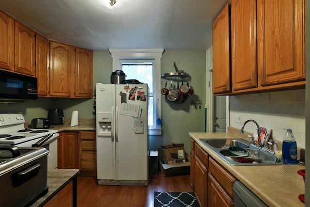 368 Alden Ave Unit 368, Columbus, OH 43201 - kitchen with white appliances, a sink, brown cabinetry, decorative backsplash, and dark wood-style flooring