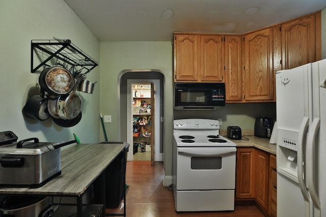 368 Alden Ave Unit 368, Columbus, OH 43201 - kitchen with white appliances, dark wood finished floors, light countertops, and brown cabinetry