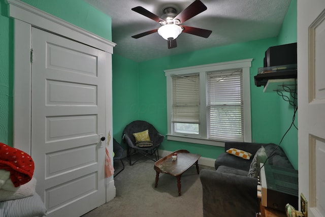 368 Alden Ave Unit 368, Columbus, OH 43201 - living area featuring a textured ceiling, ceiling fan, carpet flooring, and baseboards