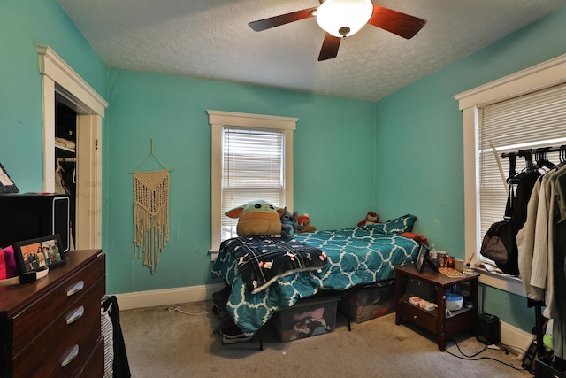 368 Alden Ave Unit 368, Columbus, OH 43201 - bedroom with a textured ceiling, baseboards, carpet floors, and a ceiling fan