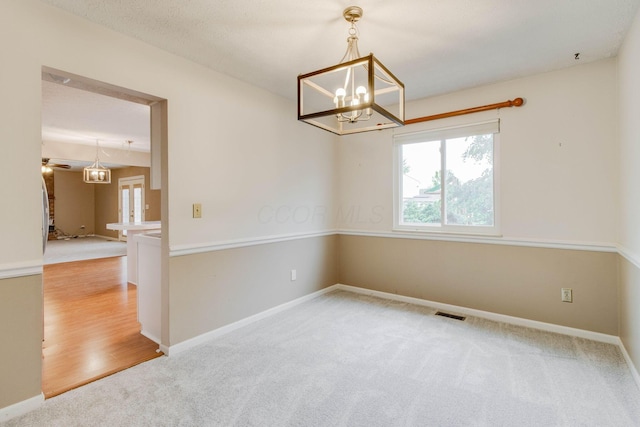 4071 Killary Dr, Dublin, OH 43016 - carpeted empty room featuring healthy amount of natural light, a chandelier, a ceiling fan, and baseboards