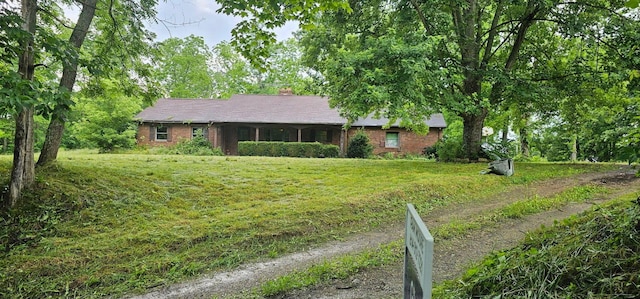 15828 Hedges Rd, Laurelville, OH 43135 - single story home featuring a front yard, brick siding, and a chimney