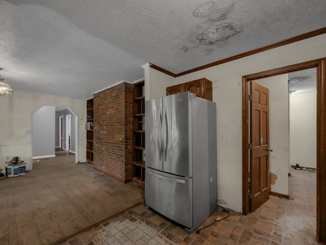 15828 Hedges Rd, Laurelville, OH 43135 - kitchen featuring freestanding refrigerator, arched walkways, crown molding, and a textured ceiling